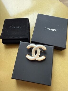 CHANEL Cream Enamel Interlocking CC Brooch with Gold Accents